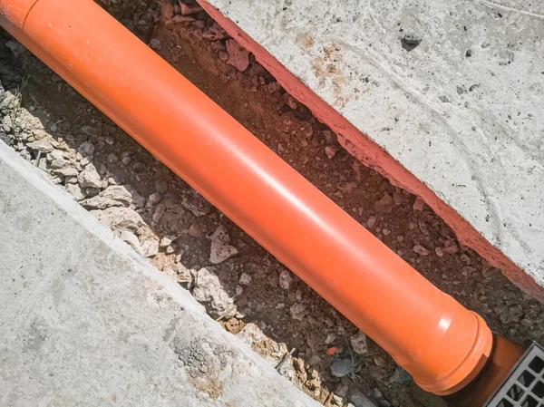 Laying Orange Plastic Drainage Pipe Top View Stock Photo
