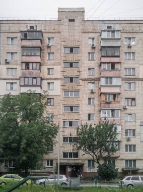 Old Soviet prefabricated nine-storey brick apartment building. Kyiv, Ukraine - August 2022.