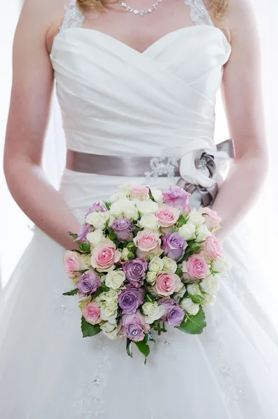 Brides bouquet and dress detail — Stock Photo, Image