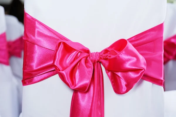 Pink bow on chair — Stock Photo, Image