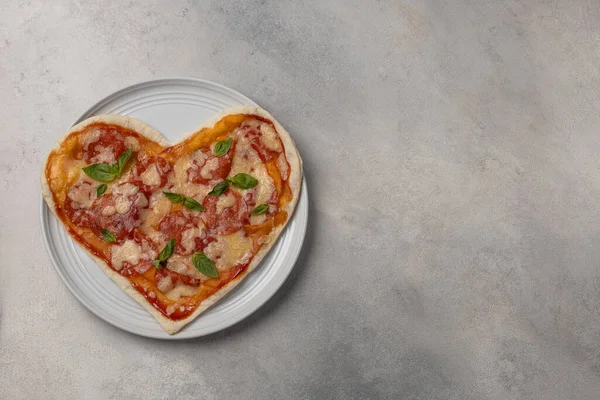 Pizza in the shape of a heart for Valentine\'s Day