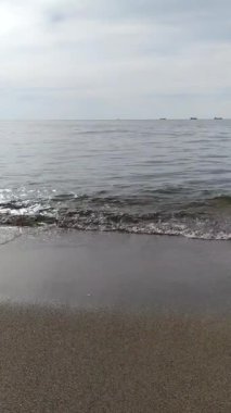 Calm sea. Silent waves. Pleasant seascape. Whisper of waves. Summer background. A seasonal phenomenon. Gentle Black Sea of Ukraine.
