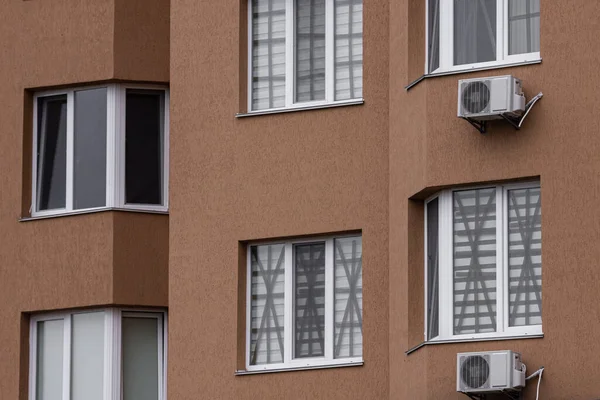 Tape-taped windows as protection against blast waves during wartime. Window protection. Blast wave. Adhesive tape on the windows of houses. Rules of survival. Life in wartime. Home protection. Russia\'s war against Ukraine. Attack on civilians.