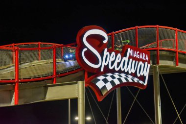 Niagara Falls, Canada - August 13, 2022: Customers enjoy the Niagara Speedway, the largest elevated go-kart race tracks in North America. It is laid out like a roller coaster.