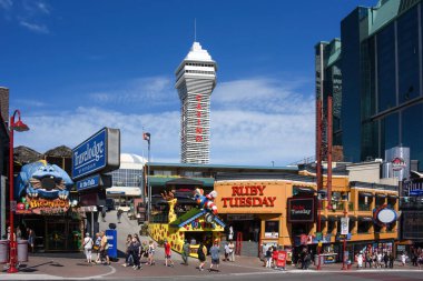 Niagara Falls, Canada - August 13, 2022: Ruby Tuesday restaurant and other tourist attractions on the busy street Clifton Hill. Casino Niagara tower can be seen in the background.