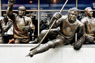 Toronto, Canada - August 12, 2022: The statues of Borje Salming, Darryl Sittler and Ted Kennedy on Legends Row outside Scotiabank Arena, the home of The Toronto Maple Leafs.