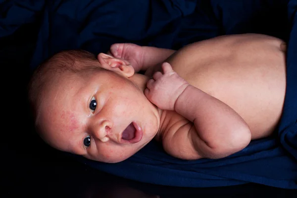 Newborn in sling — Stock Photo, Image