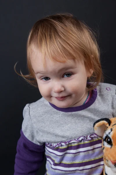 Girl with christmas toy — Stock Photo, Image