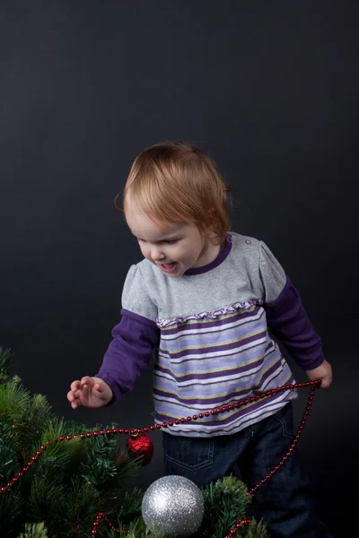 Girl with christmas toy — Stock Photo, Image