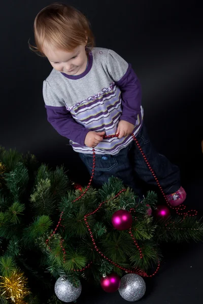 Chica con juguete de Navidad —  Fotos de Stock