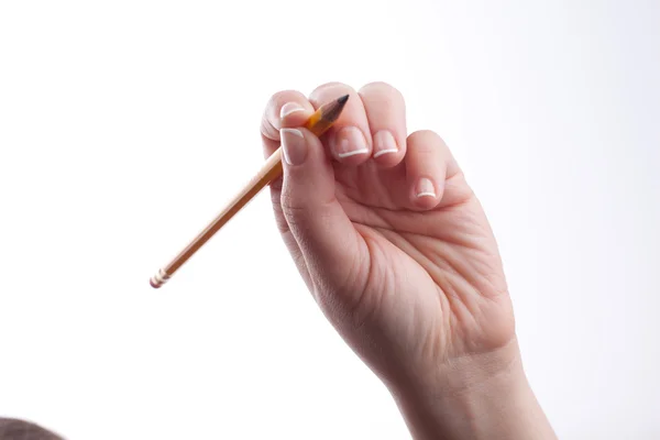 Woman hand holding a pencil — Stock Photo, Image