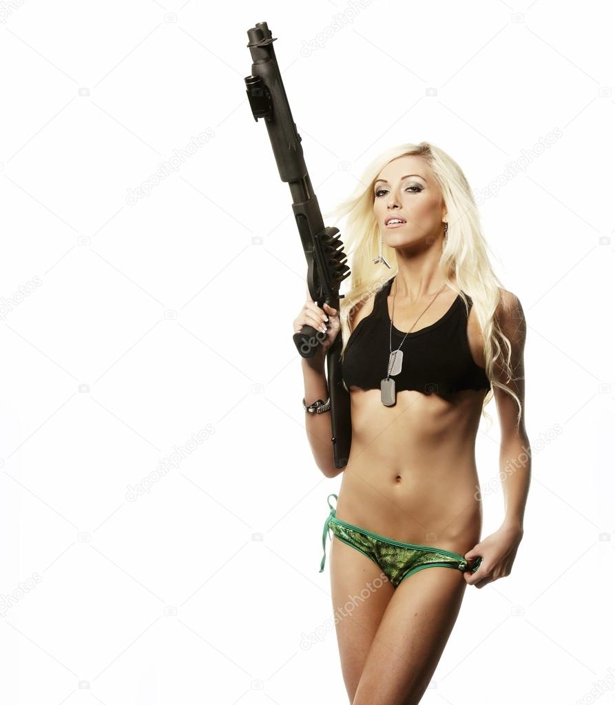 Sexy beautiful woman holding gun