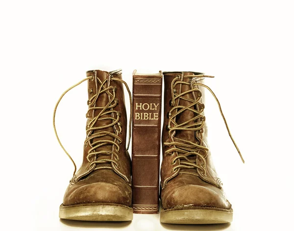 Holy bible and rugged boots — Stock Photo, Image