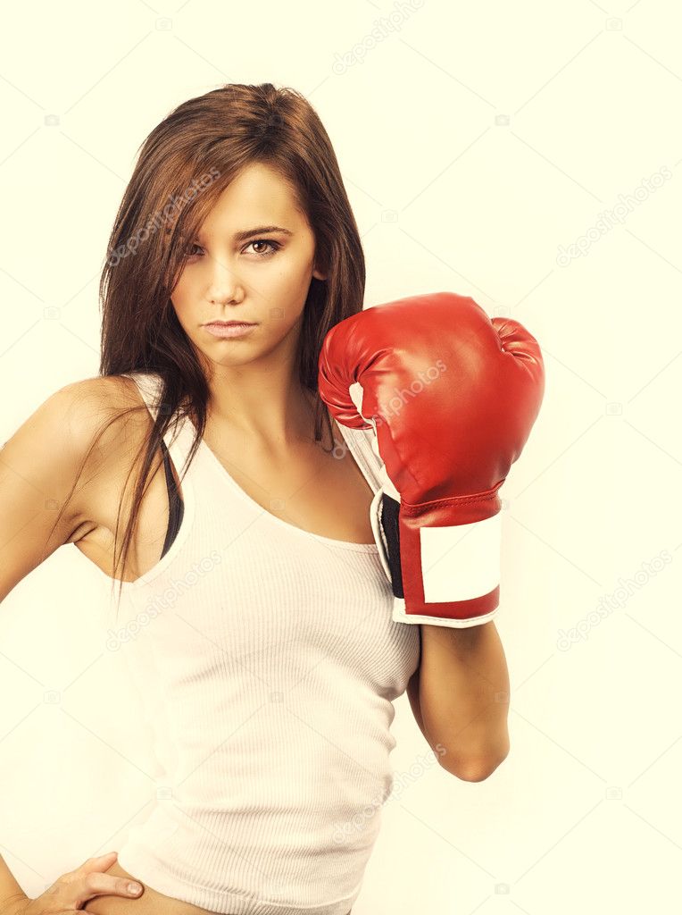 Attractive woman wearing boxing gloves — Stock Photo © paulmhill 12326875
