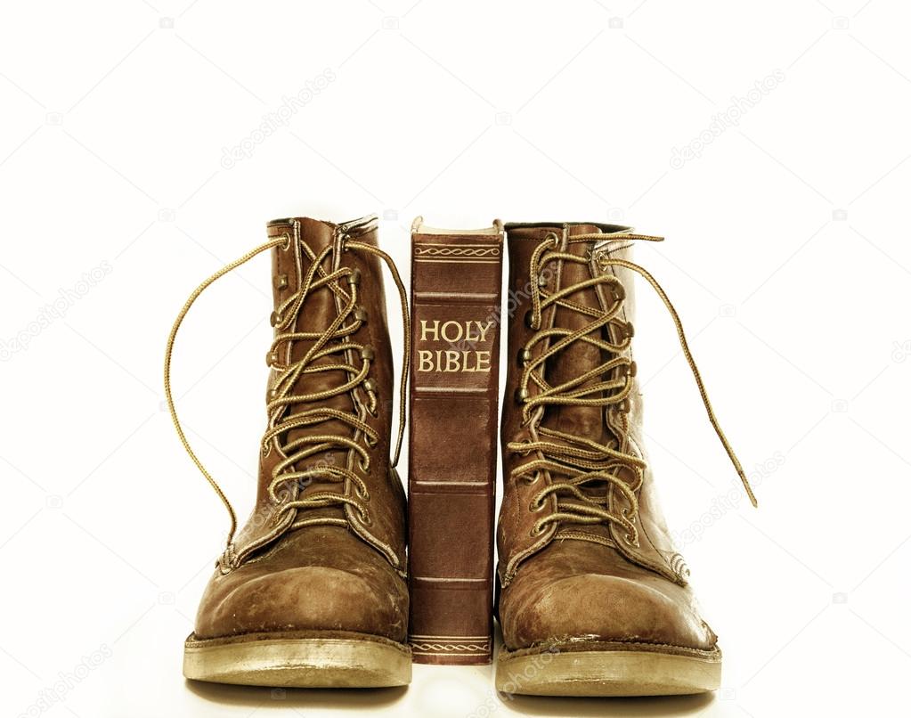 Holy bible and rugged boots