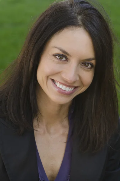 Attractive business woman turning around with big smile — Stock Photo, Image