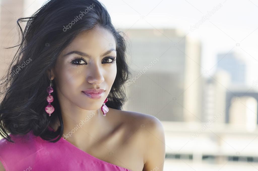 Young woman with city skyline background