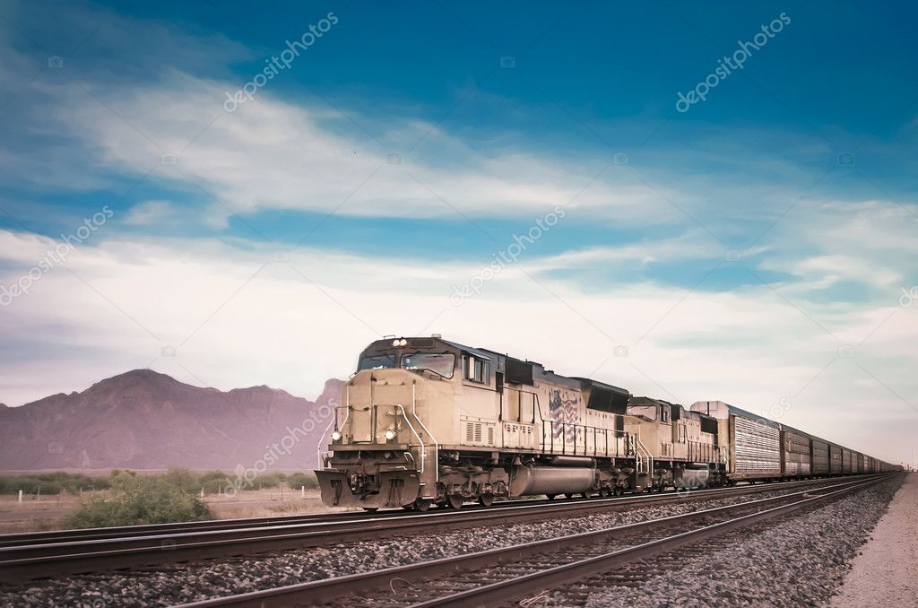 Freight train traveling through desert