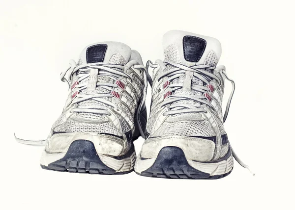 Klassieke versleten sport lopen of sportschool sneaker trainer schoen voet ware — Stockfoto