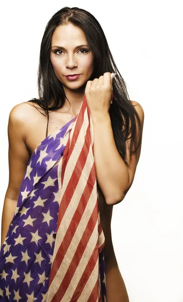 Mulher bonita envolto em bandeira americana — Fotografia de Stock