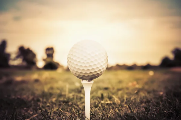 Golf ball on tee - aged nostalgic historic elegant style — Stock Photo, Image