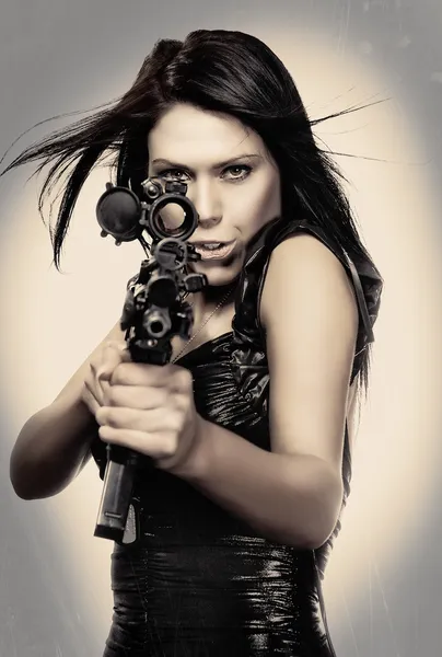 Sexy woman holding weapon gun rifle — Stock Photo, Image