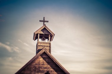 Rural old fashioned church steeple with bell clipart