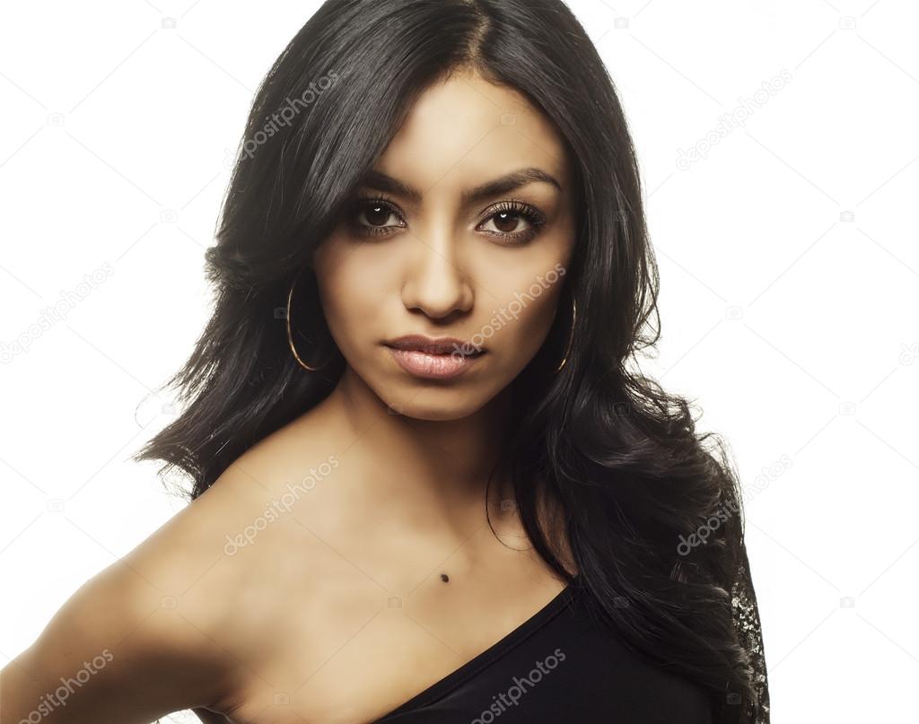 Beautiful exotic looking woman smiling — Stock Photo © paulmhill 43063687