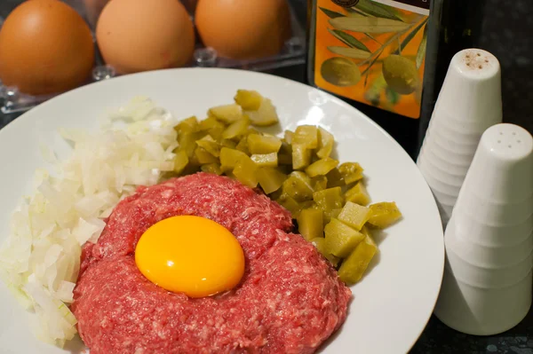 Raw beef tatar meet with egg yolk on it — Stock Photo, Image