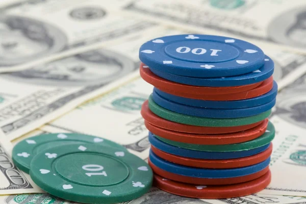 Playing chips on a dollars banknotes — Stock Photo, Image