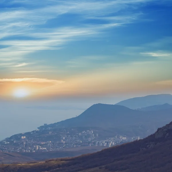 Sunrise over a sea town — Stock Photo, Image