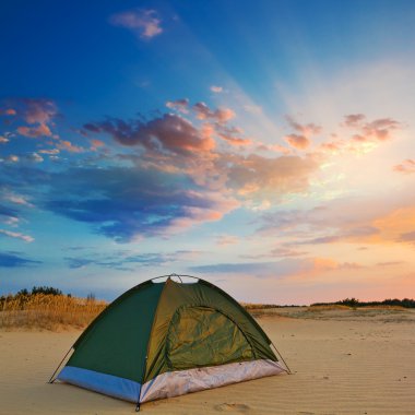 Touristic tent in a evening sand desert clipart