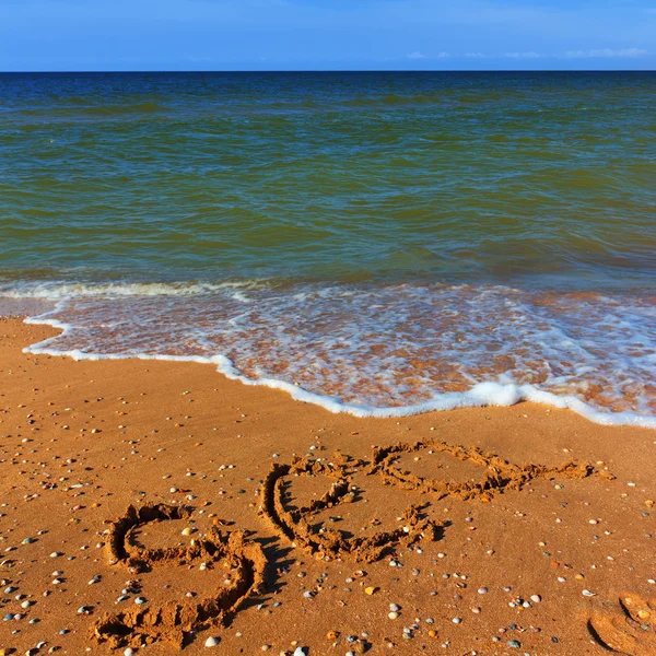 海の言葉、砂の上を描画します。 — ストック写真