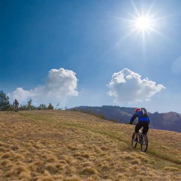 Cyclist in a steppe — Stock Photo, Image