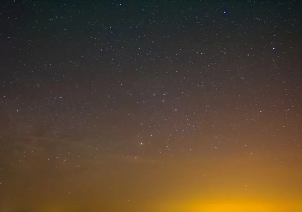 Night sky above a town — Stock fotografie
