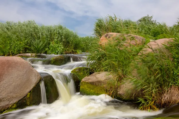 Water cascades on a stony river — Stock Photo, Image