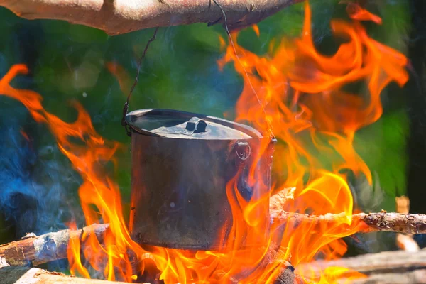 Touristic cauldron in a camp fire