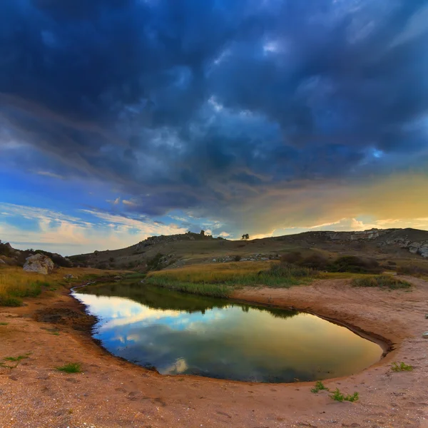 Lake in a sand at the evening — Stock Photo, Image
