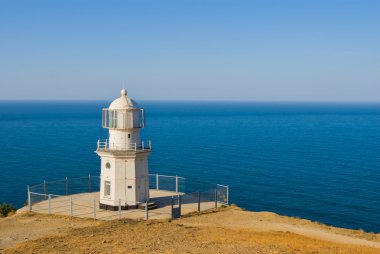 lighhouse deniz pelerin akşam üzerinde