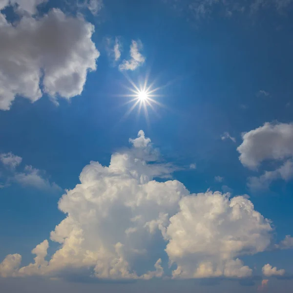 dense cumulus clouds and sparkle sun natural sky background