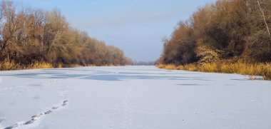 frozen river covered by snow