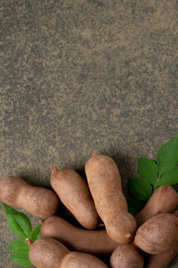 Tamarind fruit on the vintage background