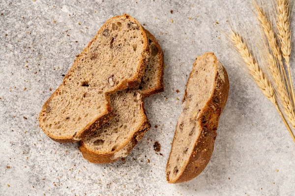 Whole wheat bread, wholemeal bread on vintage background