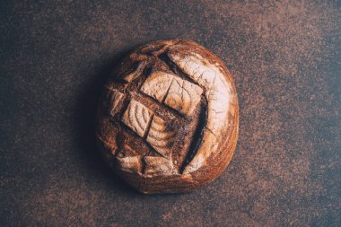 Fresh and delicious bread on the vintage background