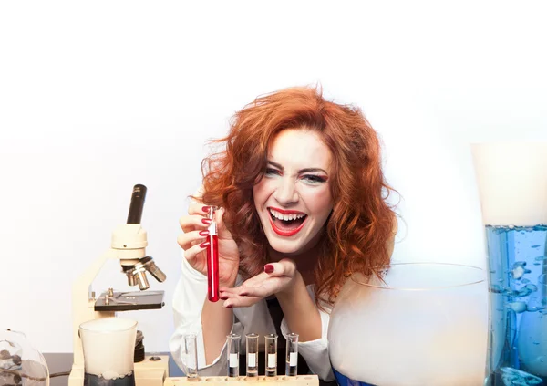 Scientist laughing with a test tube — Stock Photo, Image