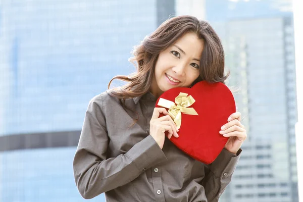Japanese business woman with a heart — Stock Photo, Image