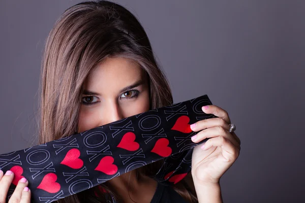 Beautiful Woman only wearing a love necktie and black — Stock Photo, Image