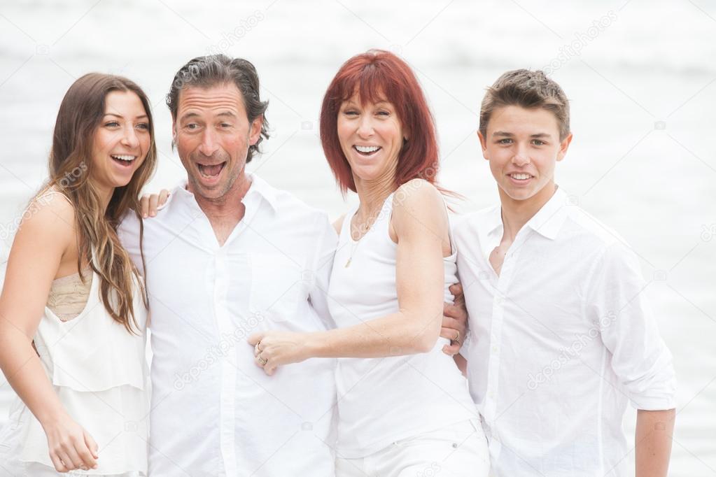 Attractive Family laughing at the Pacific Ocean