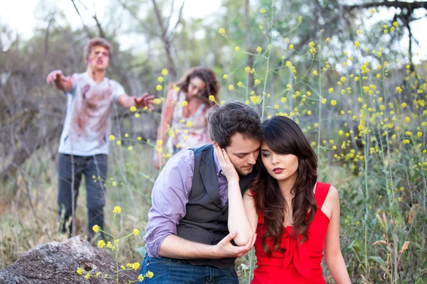 A tender moment interupted by Zombies — Stock Photo, Image