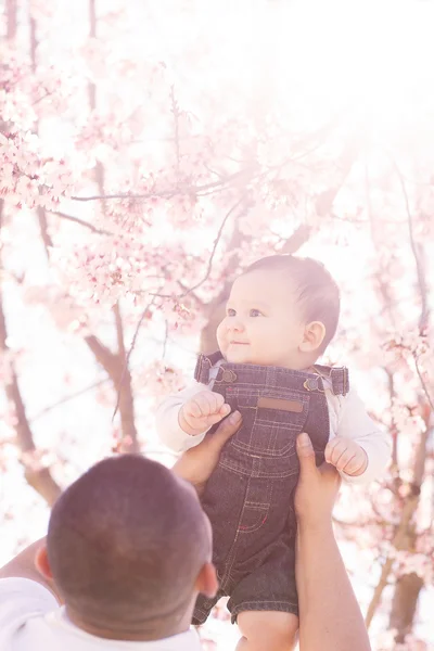 Young Father lifting up his son — Stock Photo, Image